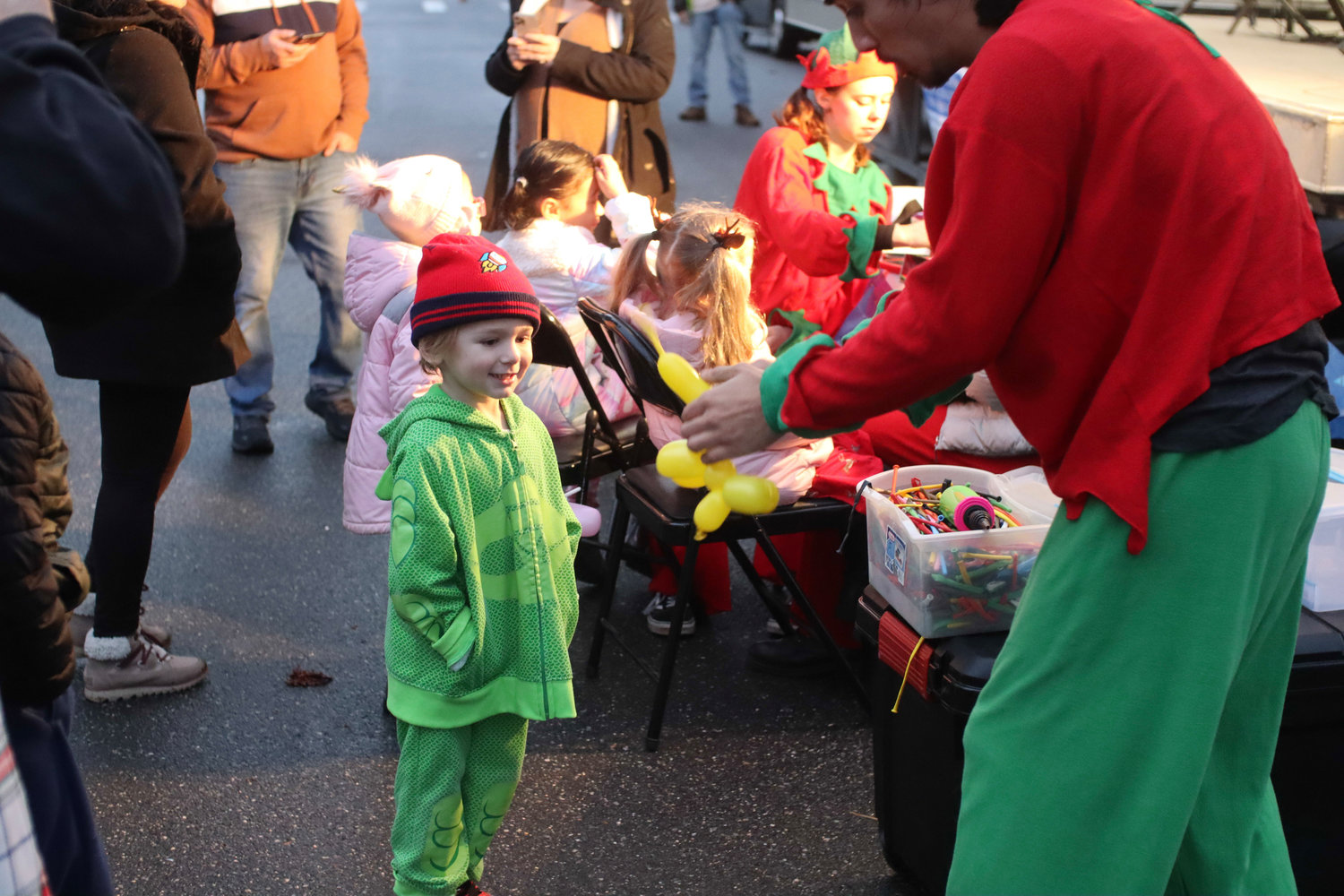 Four-year-old Dominic Avallone got excited as he watched an elf make a balloon animal for him.